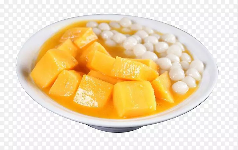 白盘子盛上芒果丸子甜品