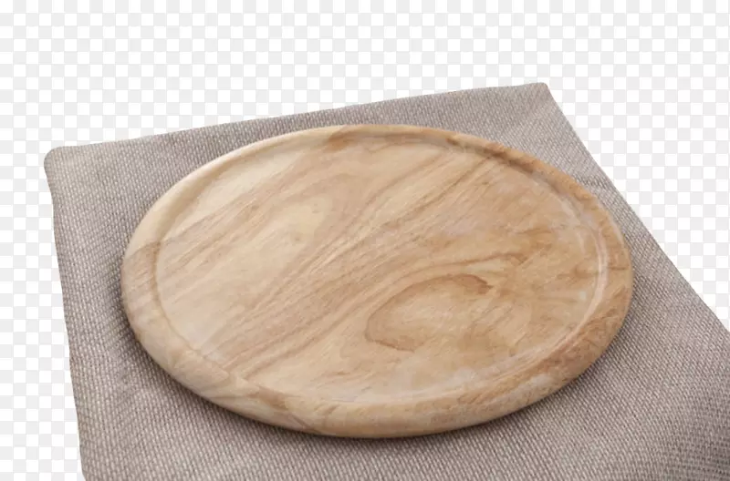 棕色木质纹理抹布上的圆木盘实物