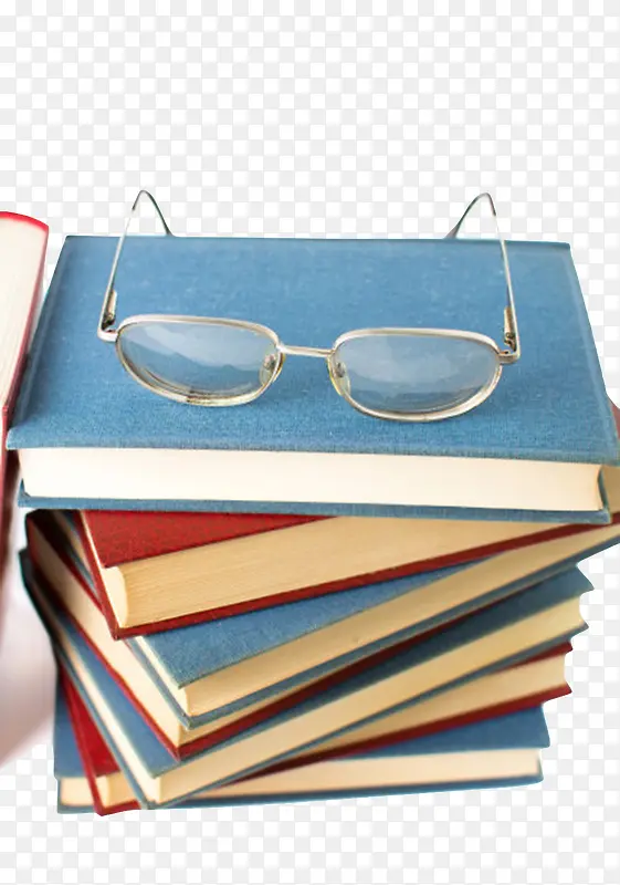 蓝色凌乱放着眼镜的堆起来的书实