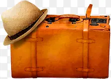 棕色皮质行李箱和帽子