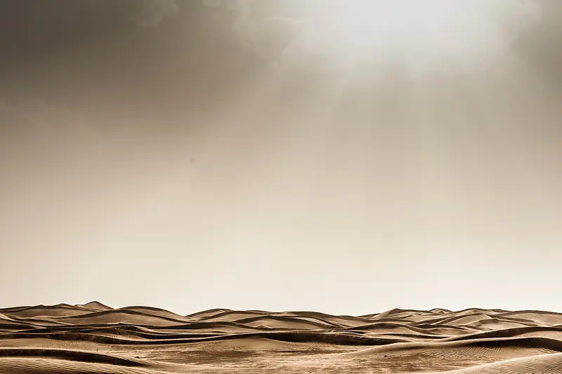 阳光照射下的沙漠海报背景
