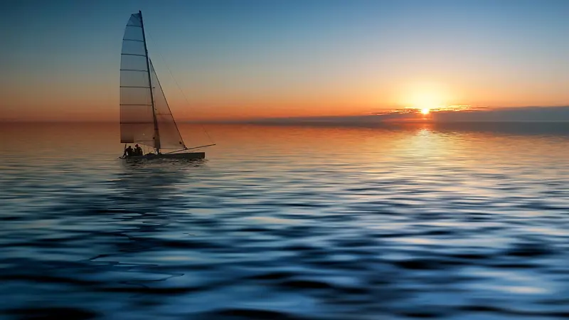 蓝天朝阳海面帆船