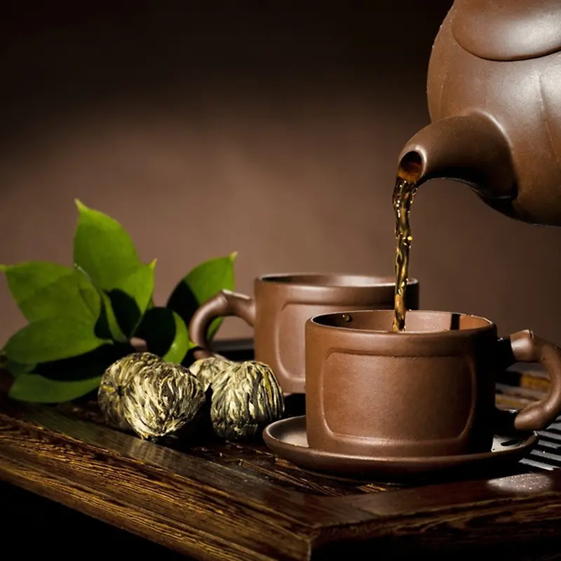 褐色茶杯茶壶茶叶背景