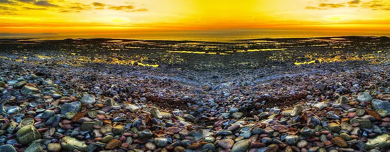 夕阳沙滩石头摄影海报