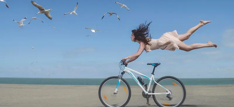 摄影蓝天美女自行车背景